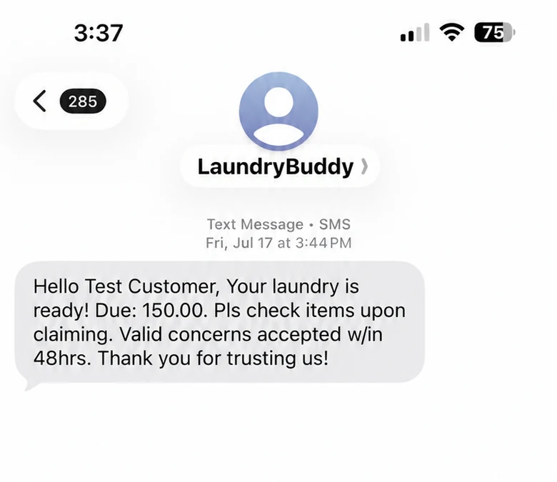 Sample Laundry Buddy SMS telling a customer that laundry is ready and showing the amount due